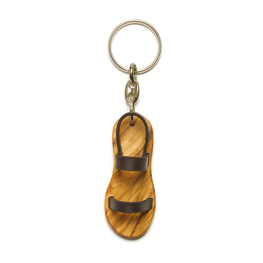 Wooden sandal keychain with leather straps, engraved with Psalm 119:105, symbolizing the pilgrimage of life.
