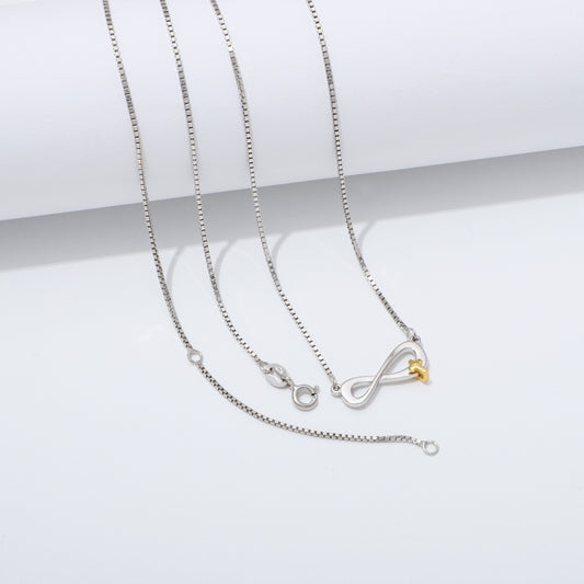 Silver 925 Sterling infinity necklace with a gold cross pendant on a white background
