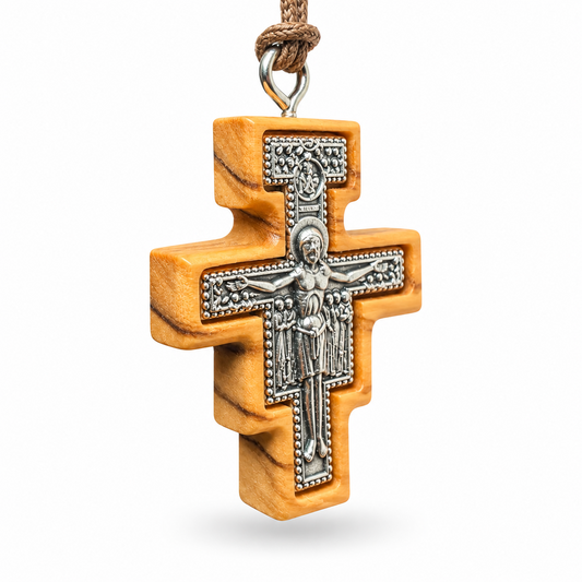 Large San Damiano olive wood crucifix necklace SCR81, angled view showing the metal inlay and wood thickness.