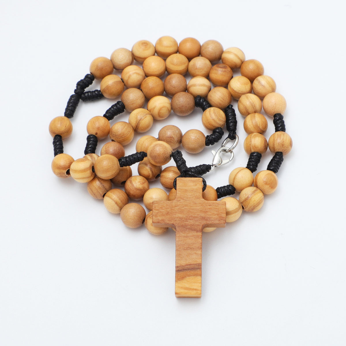 Coiled 8mm olive wood rosary necklace showing the cross, knotted cord and clasp