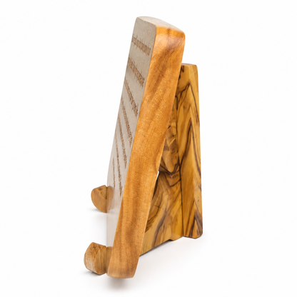 Side view of the John 4:13–14 olive wood scripture plaque showing its rounded edge, thickness and matching display stand.