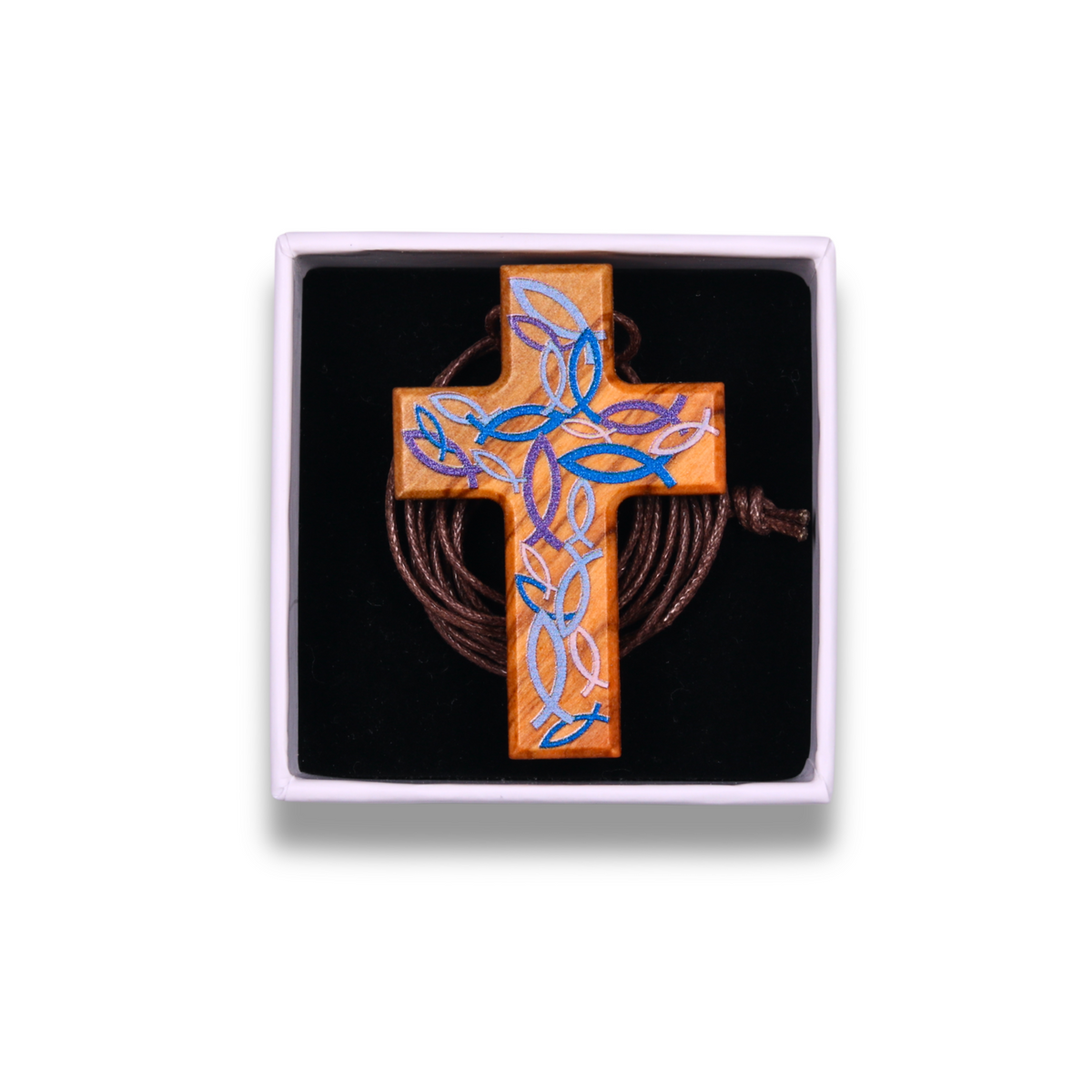 Handcrafted olive wood cross necklace featuring intricate blue and violet Ichthus fish engravings forming a woven pattern on the surface, suspended on a brown cord. In a gift box.