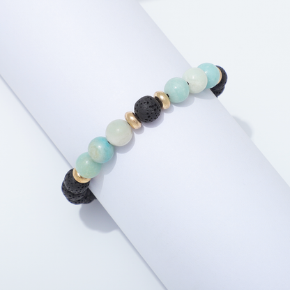 Lava Stone & Moonstone Bracelet Around White Cylinder
