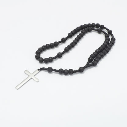 Lava stone prayer rosary arranged in loops on a white background