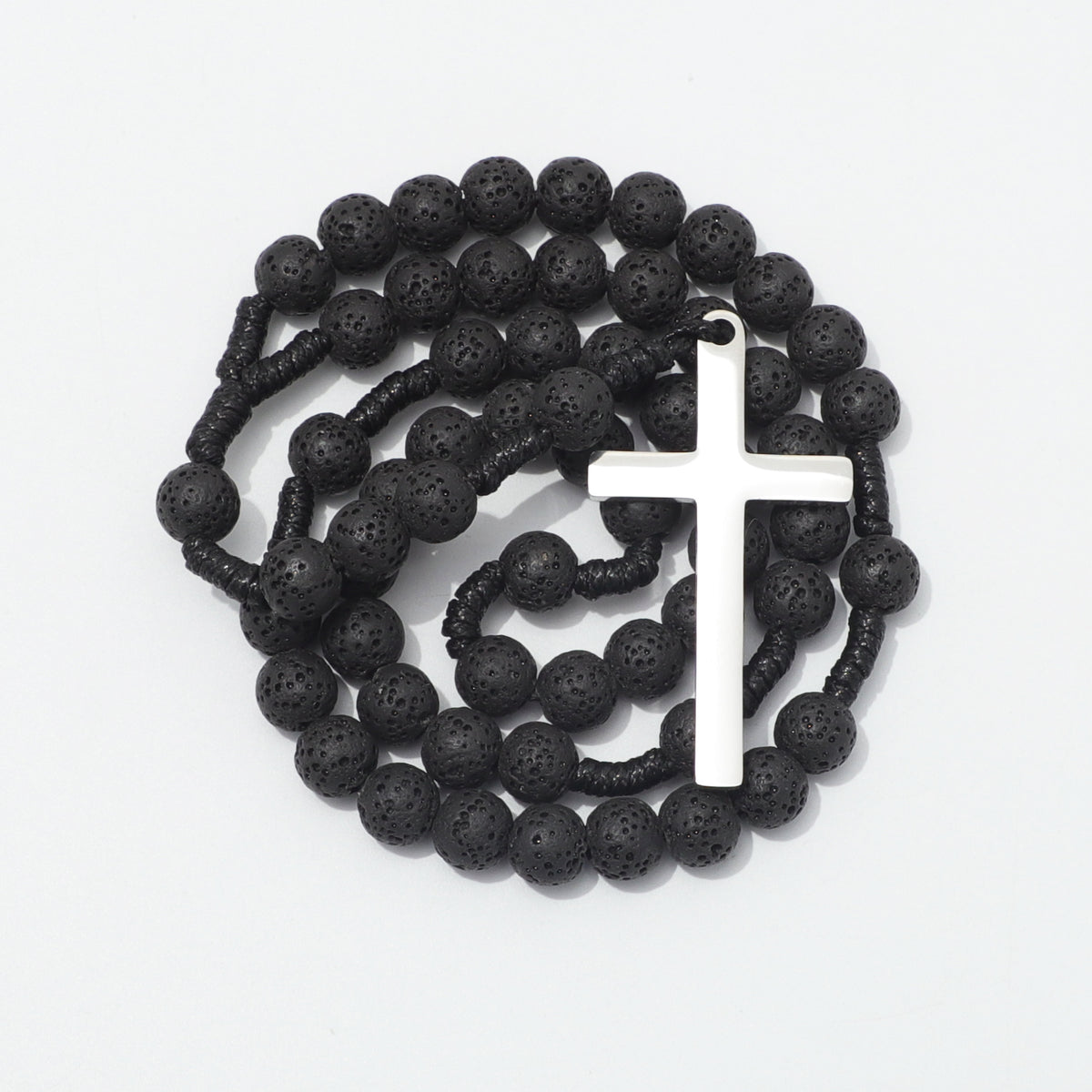 Coiled lava stone rosary with a plain silver toned cross