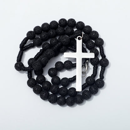 Coiled black lava stone rosary with a plain silver toned cross