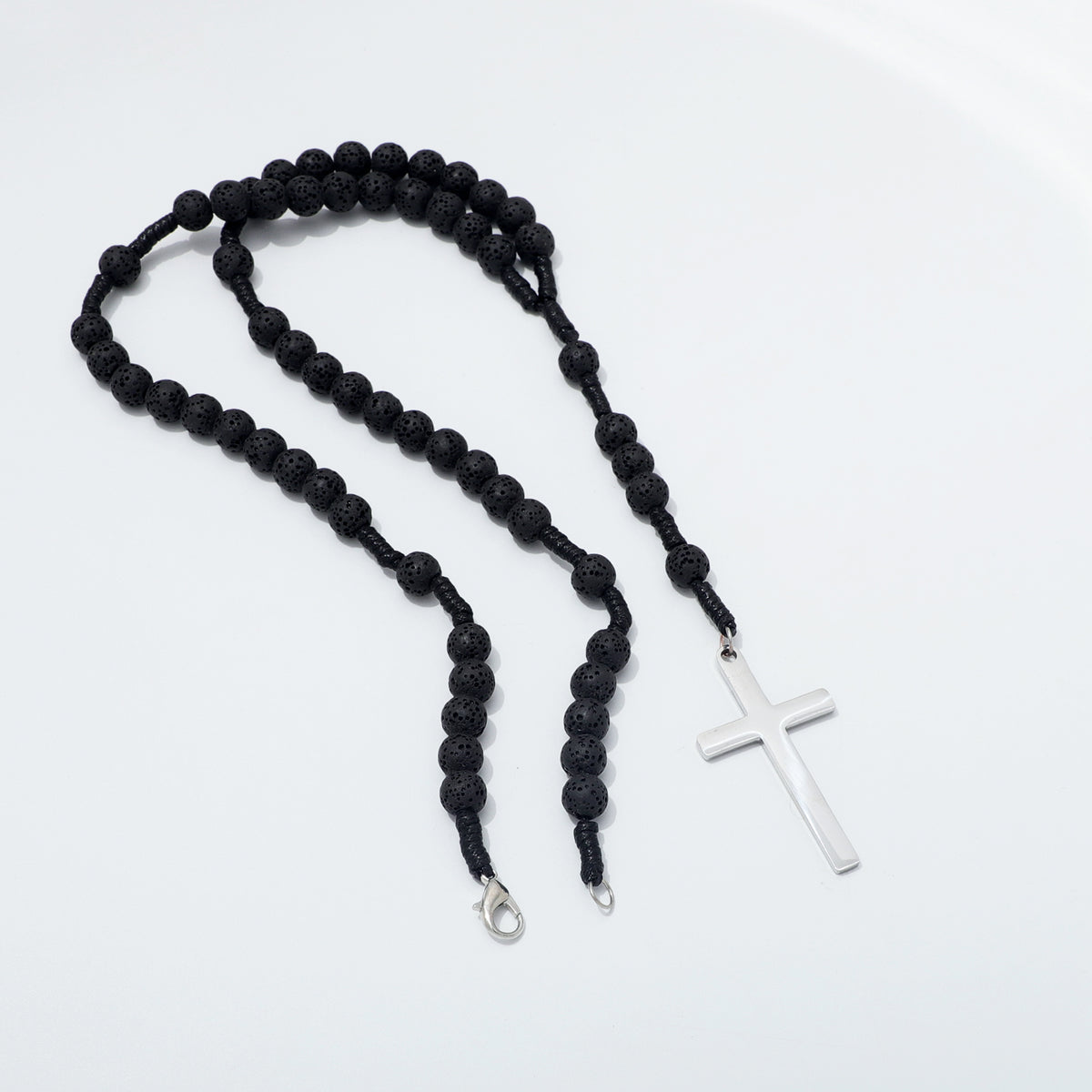 Lava stone rosary necklace opened to show both ends of the clasp