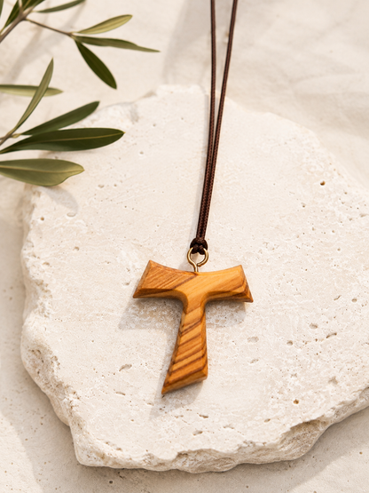 Detail view of Tau Origin Olive Wood Cross Necklace