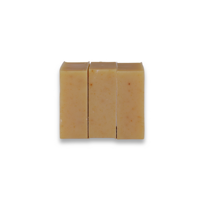 Three bars of soap stacked on a white background