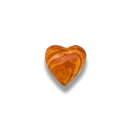 Olive wood heart shape on a white background