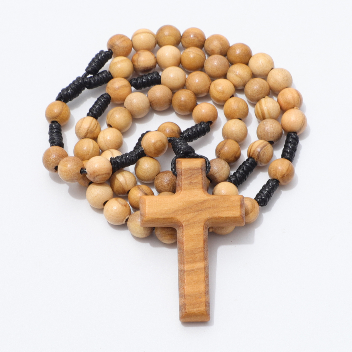 Coiled olive wood pocket rosary with cross and black knotted cord