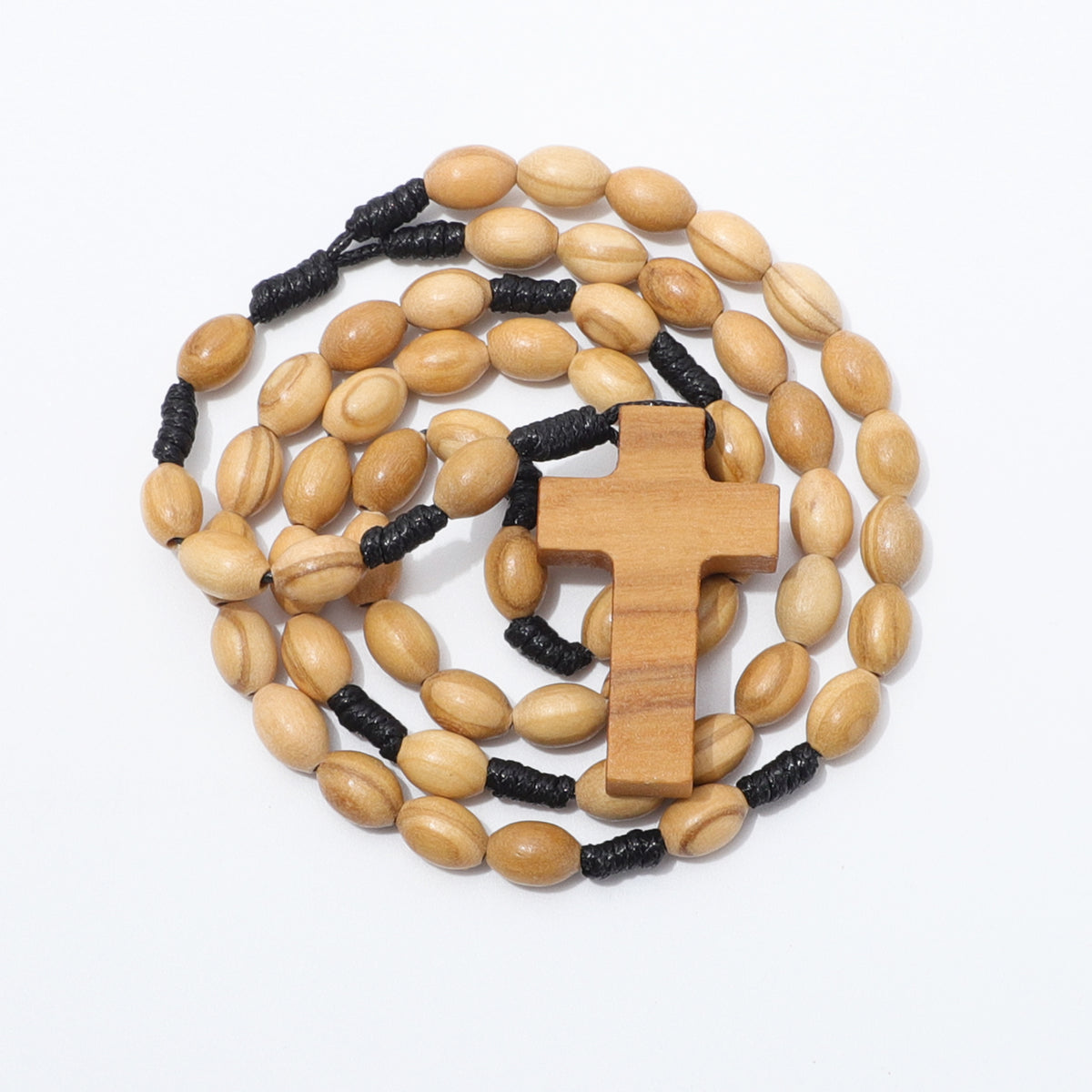 Coiled oval olive wood rosary with a wooden cross and black knotted cord