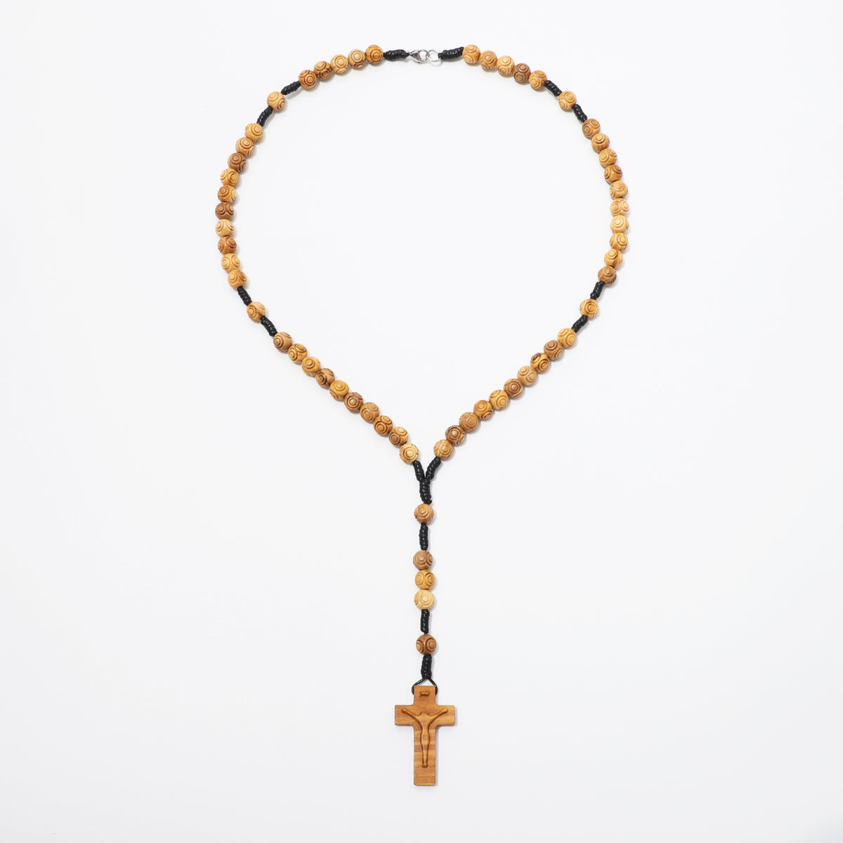 Engraved olive wood rosary necklace with 8mm beads laid out on a white background