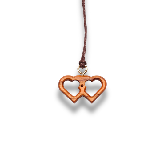 Olive Wood pendant shaped like two interlocking hearts on a white background