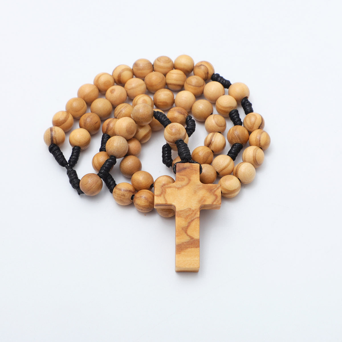 Coiled 8mm olive wood rosary with a wooden cross in front