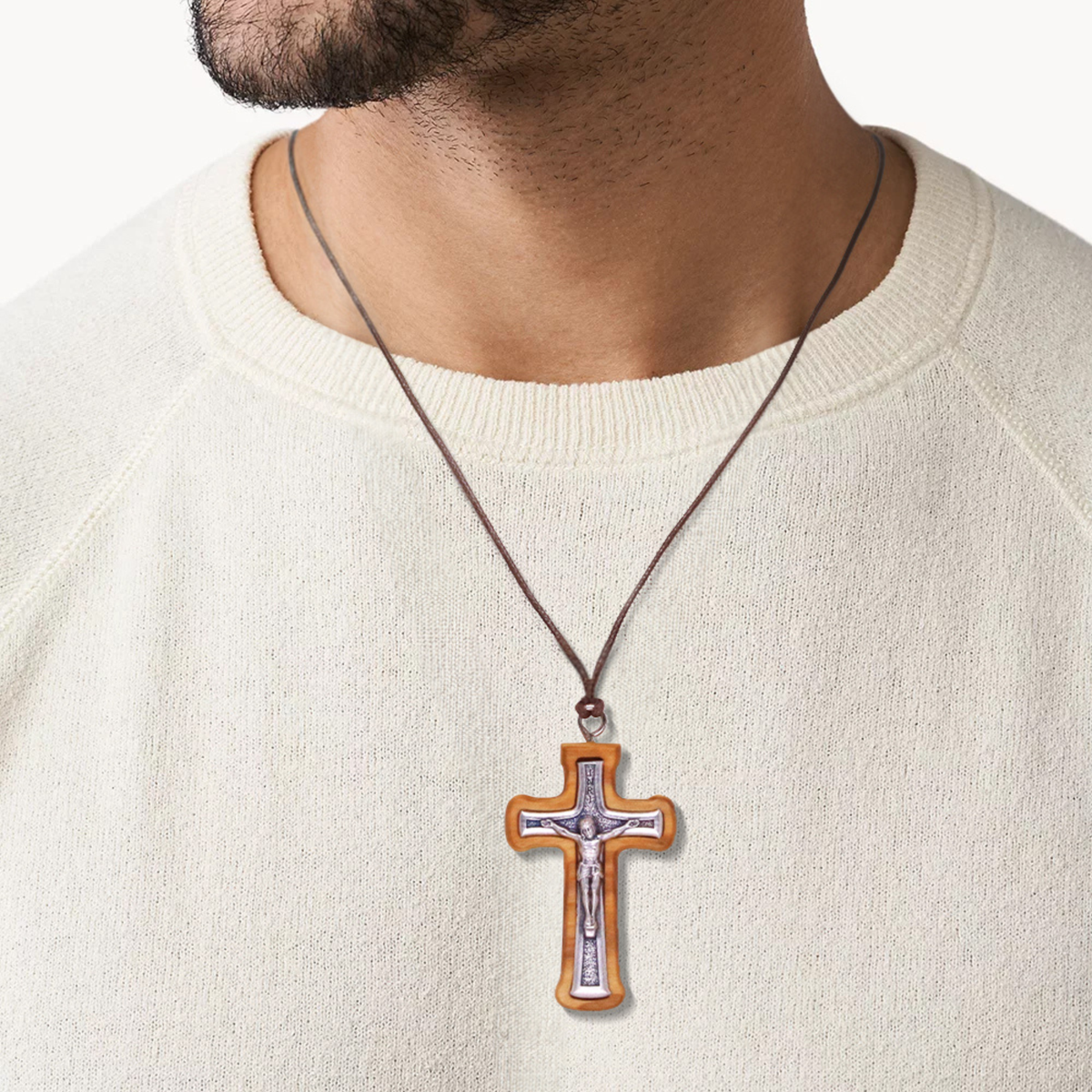 Man wearing a Handcrafted Radiant Olive Wood Crucifix Necklace