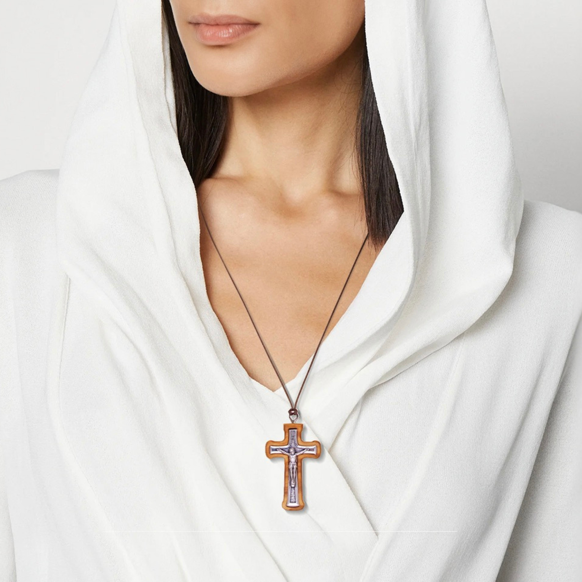 Woman wearing a Handcrafted Radiant Olive Wood Crucifix Necklace