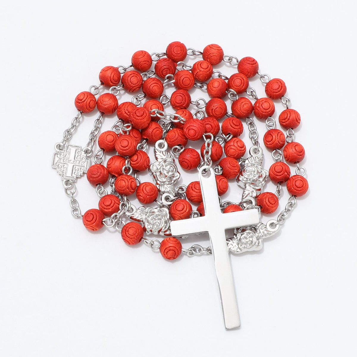 Coiled engraved red bead rosary with rose connectors and plain metal cross