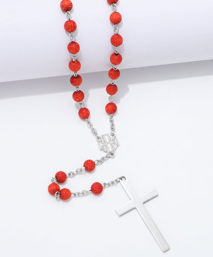 Detail of engraved red beads, Jerusalem Cross centerpiece and plain cross