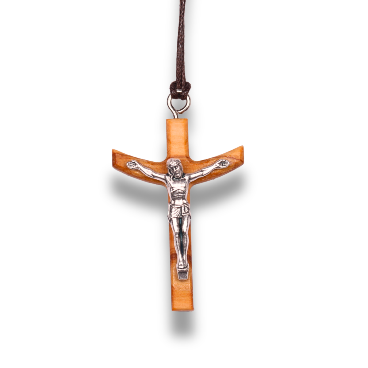 Olive wood cross pendant with silver Jesus figure on a white background