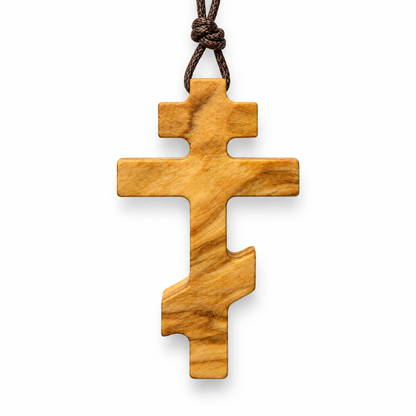 Large Russian Orthodox olive wood cross necklace on a brown cotton cord, front view