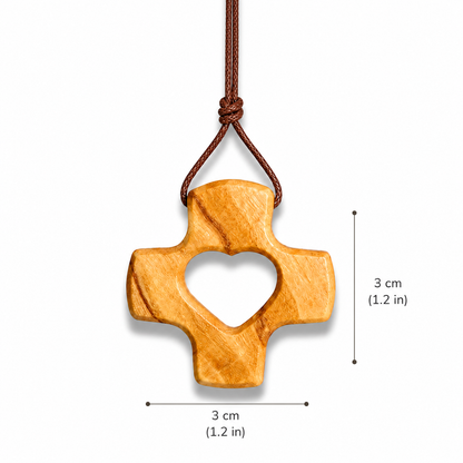 Wooden cross pendant with heart cutout on a brown cord, shown with measurements.