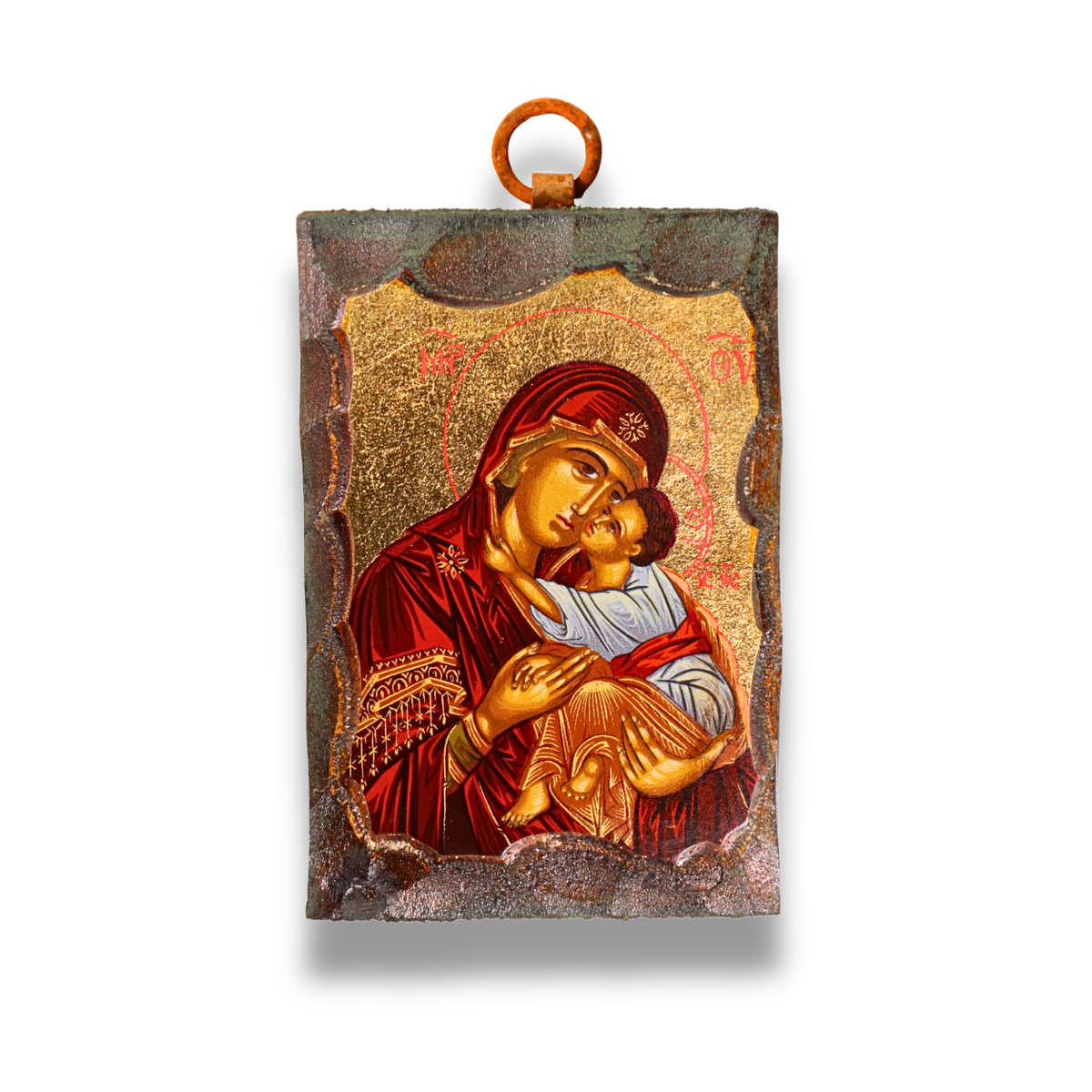 An icon of the Virgin Mary in a red robe holding the child Jesus, with both figures haloed against a gold leaf background. Above them are two angels, and the icon is bordered by a dark, textured frame with a metal loop at the top for hanging.
