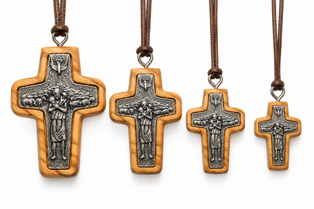 Four Good Shepherd olive wood cross necklaces inspired by Pope Francis, arranged from large to extra small on brown cords