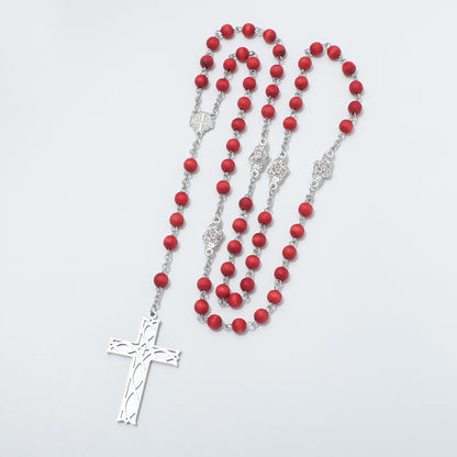 Red bead rosary with Jerusalem Cross centerpiece arranged in long loops