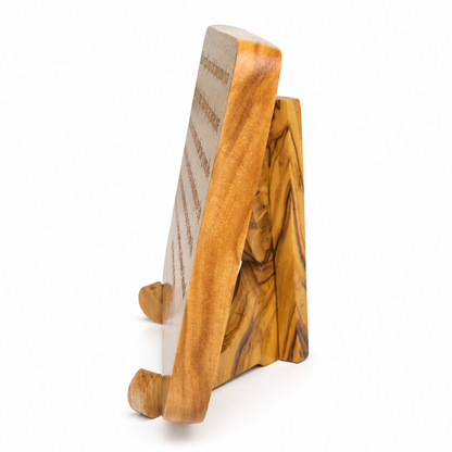 Side view of the olive wood John 15 scripture plaque showing its rounded edge, thickness and wooden stand.