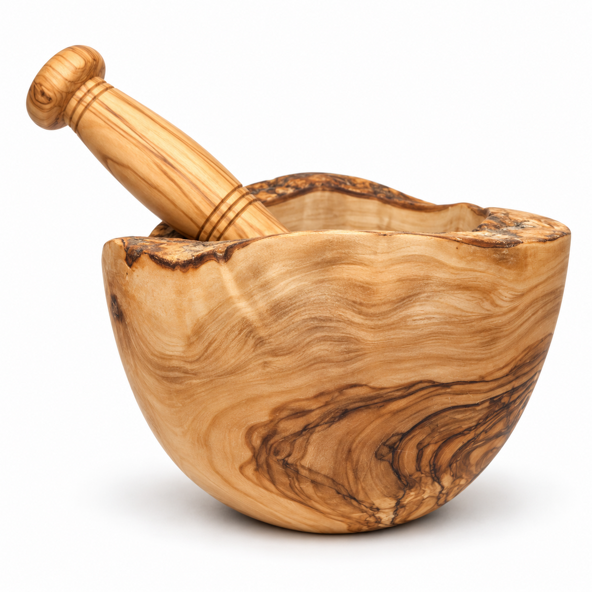 Side view of the handmade olive wood mortar, showing its curved bowl, natural rim and matching pestle.