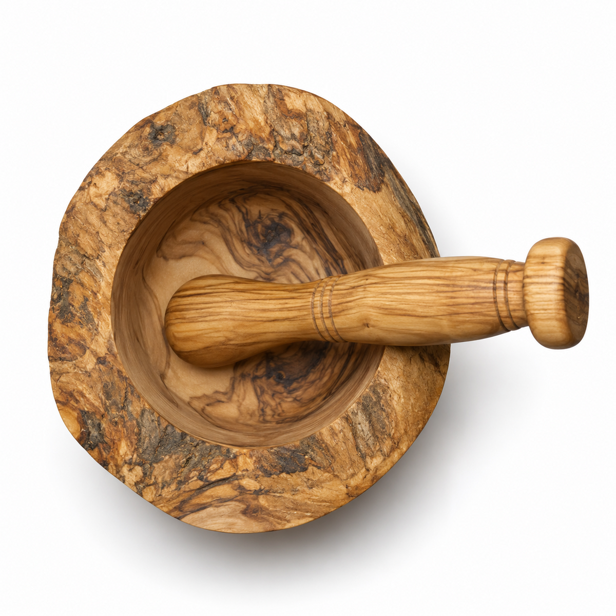 Top view of the rustic olive wood mortar with the pestle resting across its round grinding bowl.