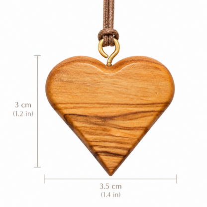 Ahavah olive wood heart pendant with measurements: 3 cm (1.2 in) high and 3.5 cm (1.4 in) wide.